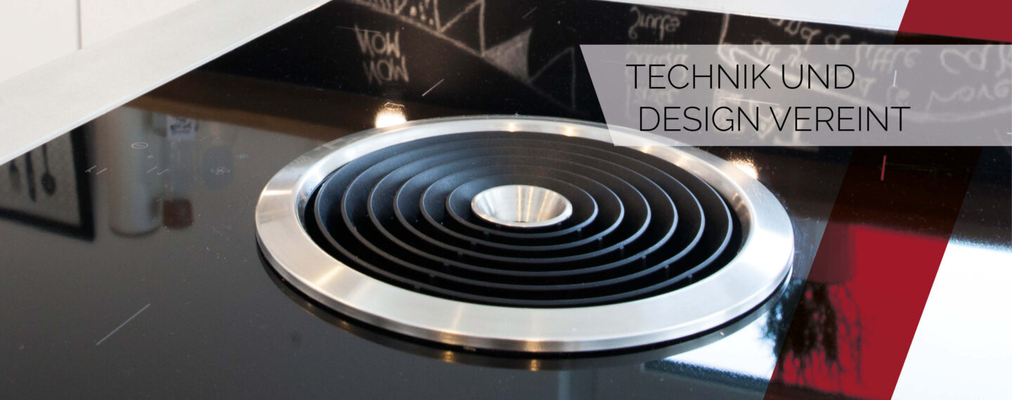 Modernes Induktionskochfeld mit integriertem Dunstabzug – innovative Küchentechnik und elegantes Design perfekt vereint